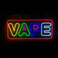 LED VAPE neon sign hanging in a vape shop window with customers in the background.